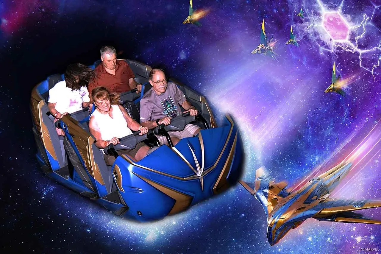 A group of people riding on the back of a roller coaster.