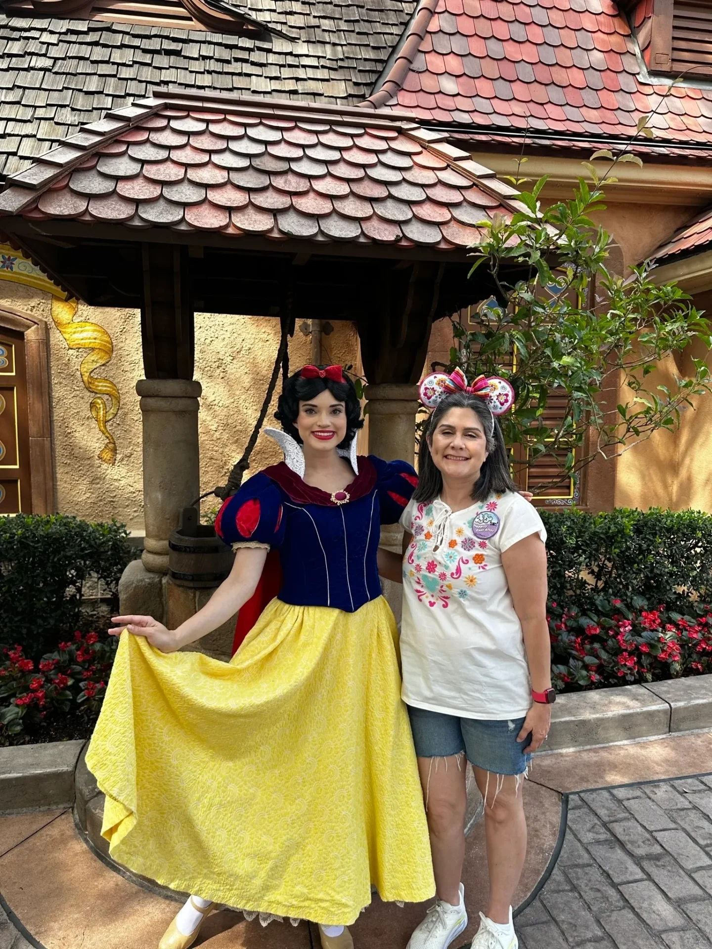 A woman and a girl posing for the camera.